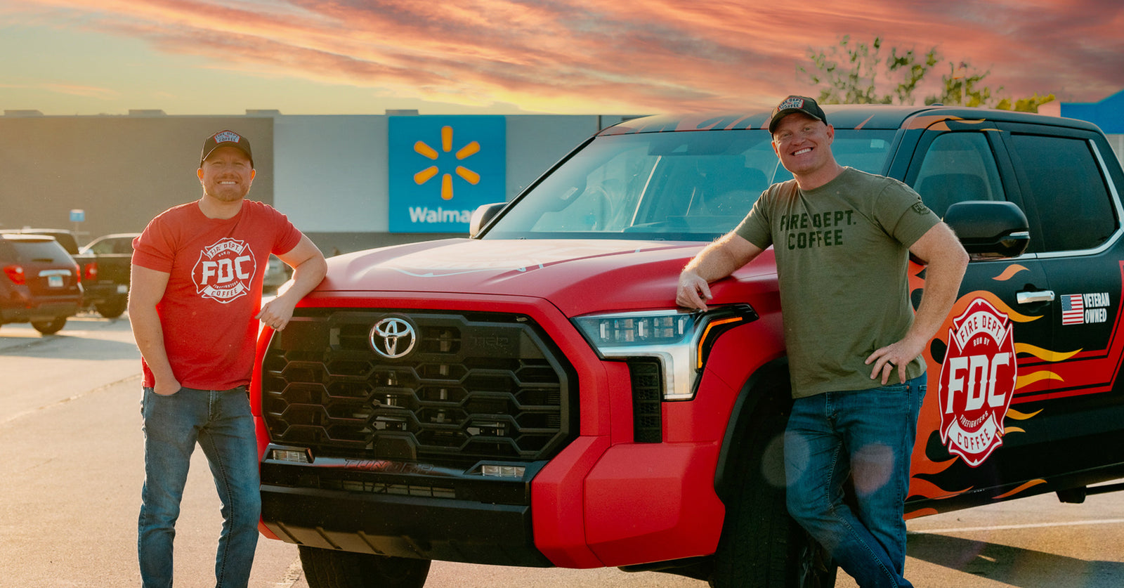 Jason Patton, VP of FDC, and Luke Schneider, CEO of FDC, standing by a red Toyota truck.