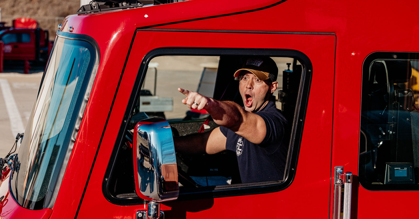 Lance Woodruff inside of a fire truck shooting a scene for a video.