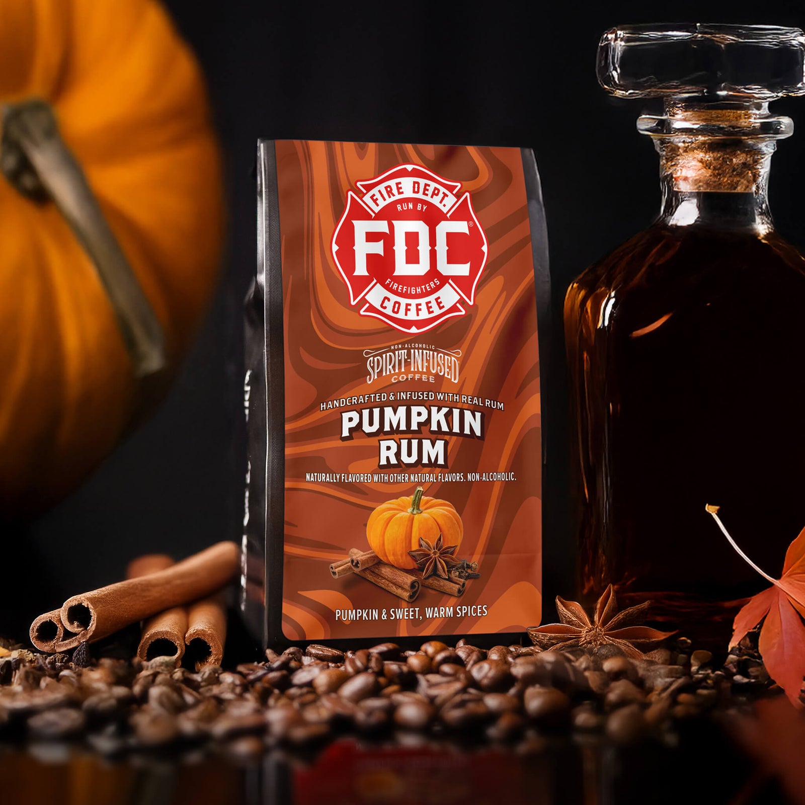 Bag of Fire Dept. Coffee Pumpkin Rum coffee with pumpkin and cinnamon sticks on a white background