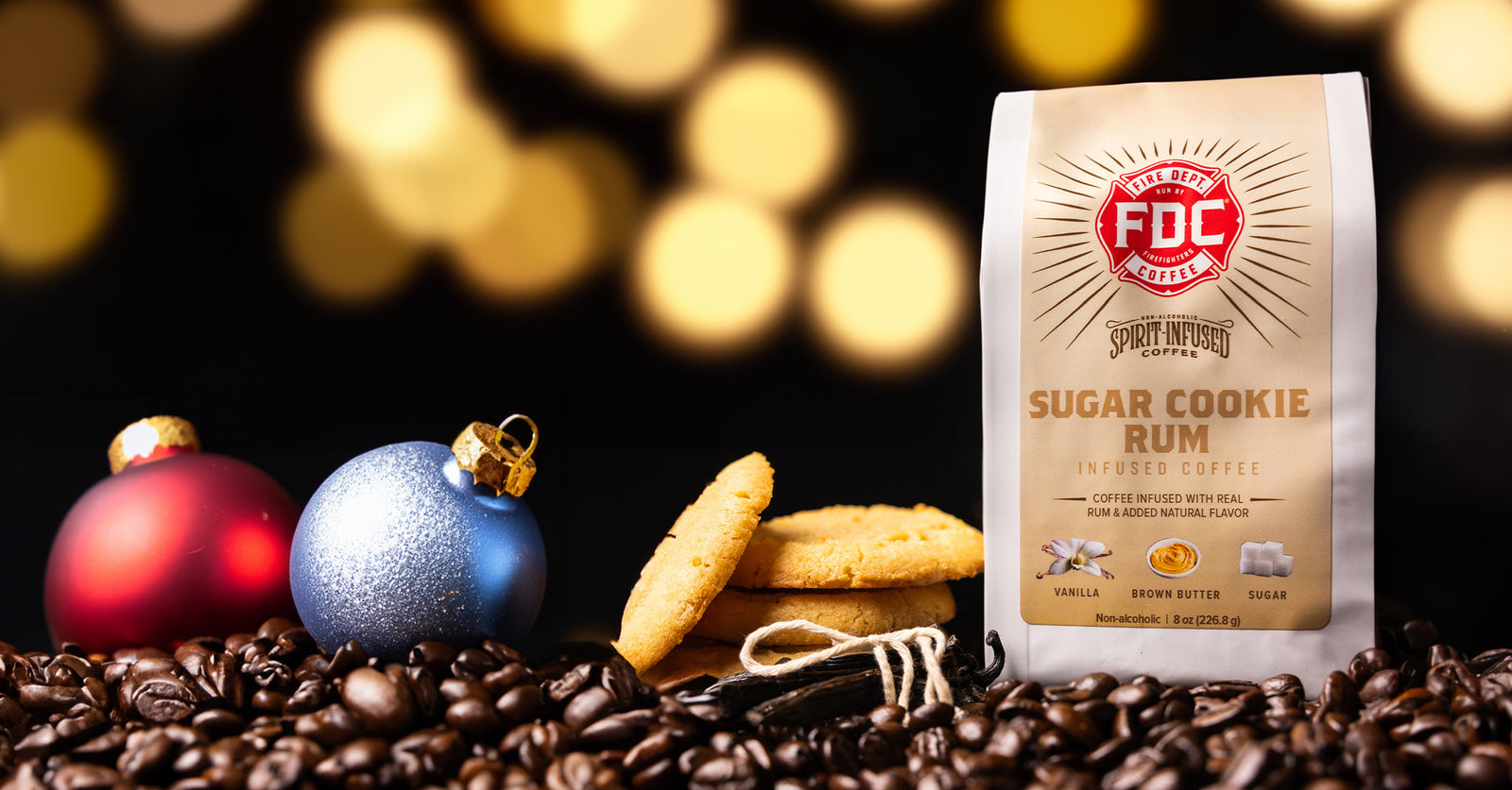 Holiday scene with sugar cookies, coffee beans and coffee bag.