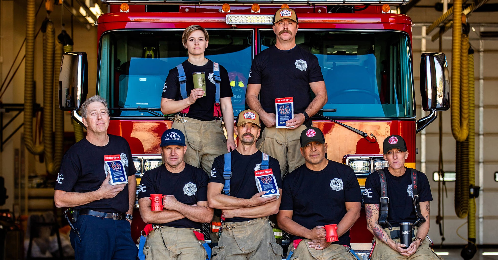 Group of Las Vegas Firefighters in front of a fire truck.