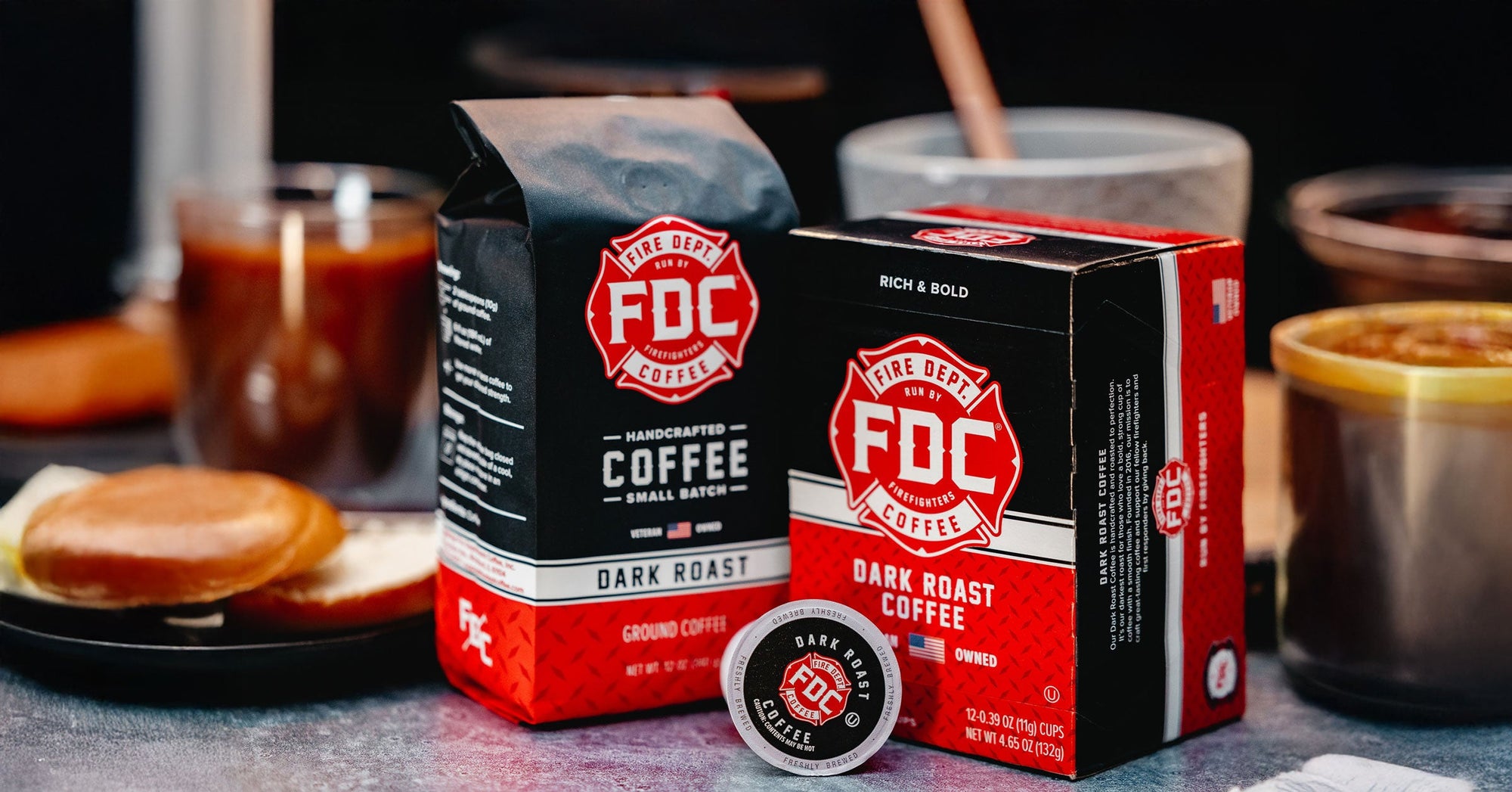 Dark Roast coffee bag and dark roast coffee pods in a kitchen setting.