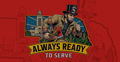 A graphic depicting Abraham Lincoln as a firefighter inside the shape of Nebraska with the ears of corn, the capitol building of Lincoln and a banner that says "Always Ready To Serve."