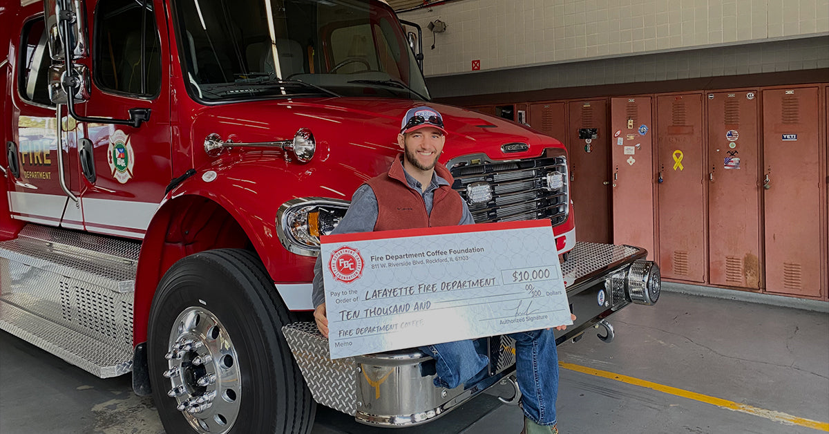 Lafayette Fire Department, Firefighter-Engineer Alex Bourque receives $10,000 donation from Fire Department Coffee Foundation.