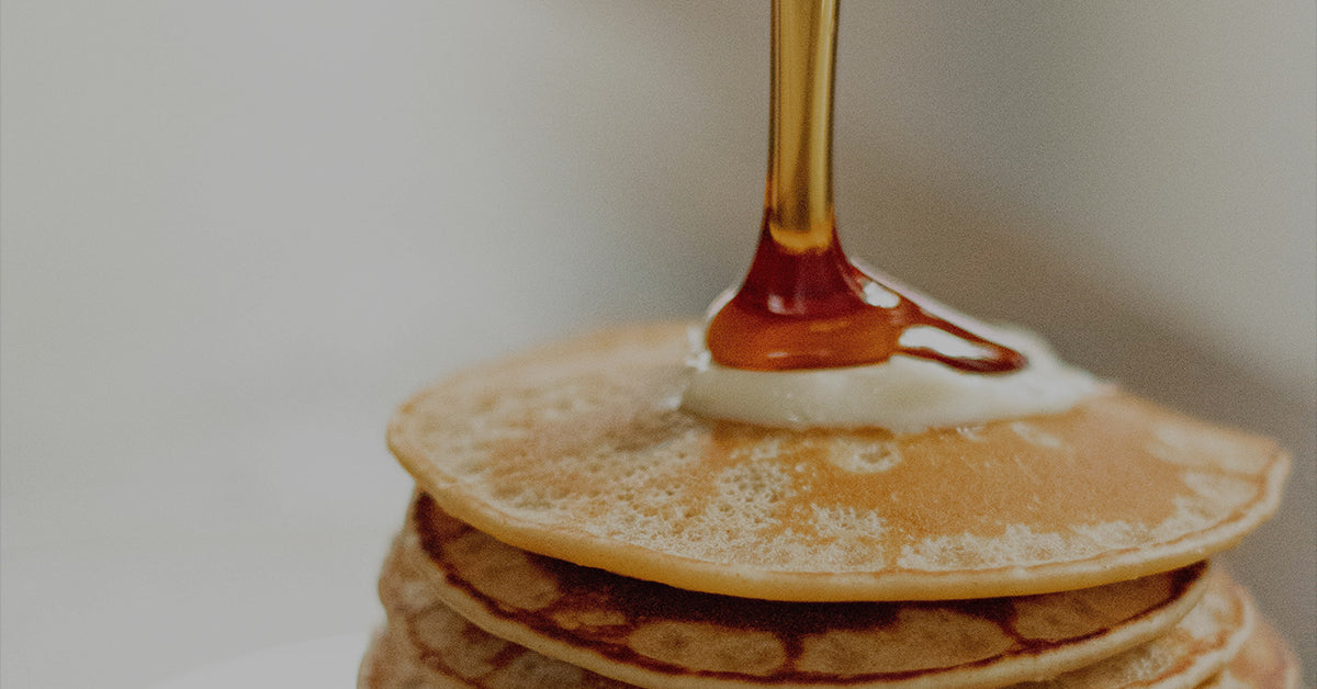 Spirit Infused Coffee Club, Maple Bourbon Infused Coffee, Image of Maple Syrup dripping on a stack of pancakes.