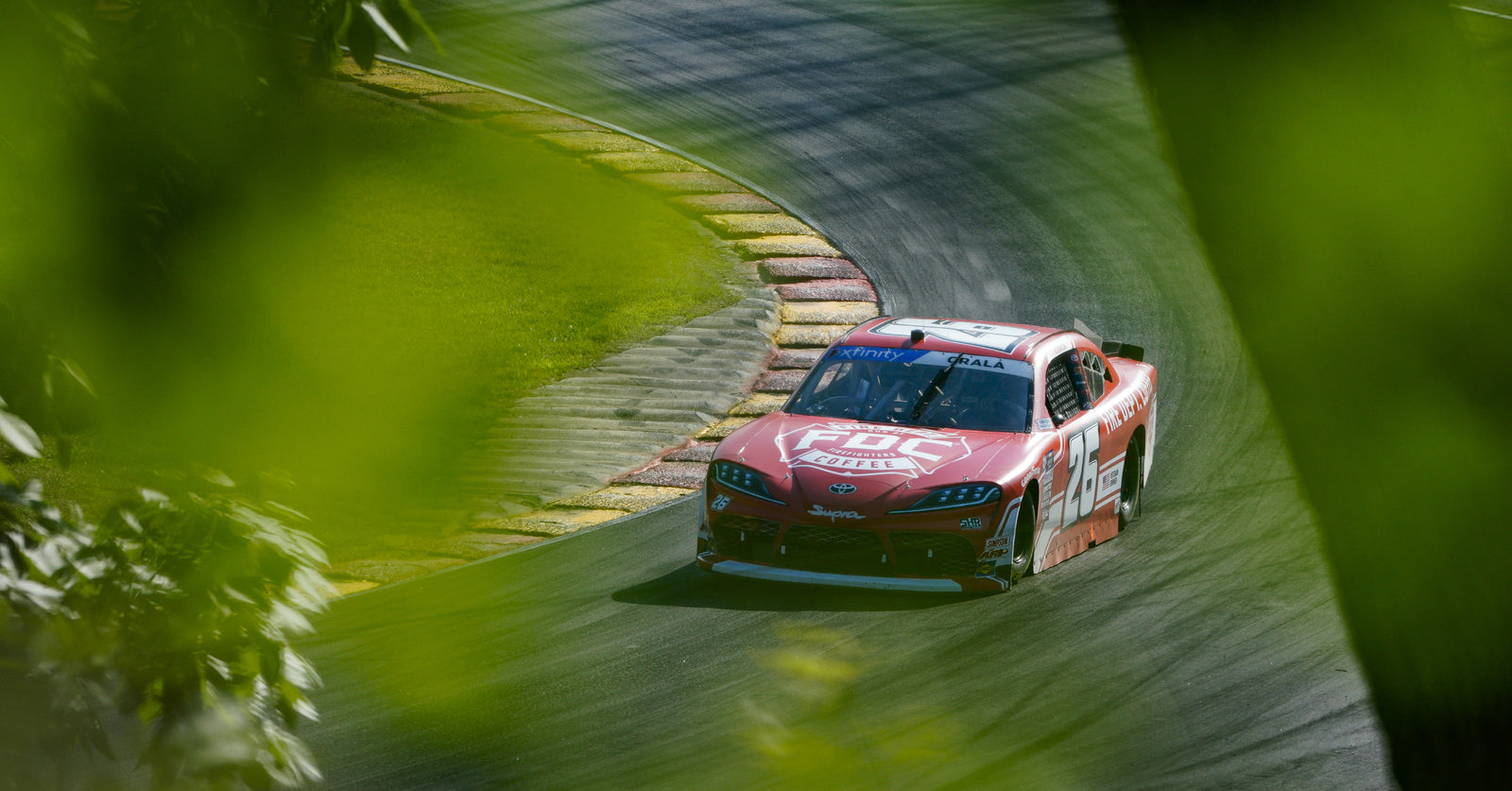 Fire Department Coffee scheme car turning the corner at the Road Americas NASCAR race.