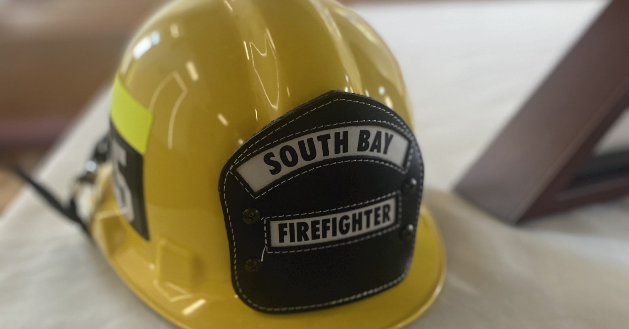 Yellow helmet worn by fallen firefighter, Damien Pereira.