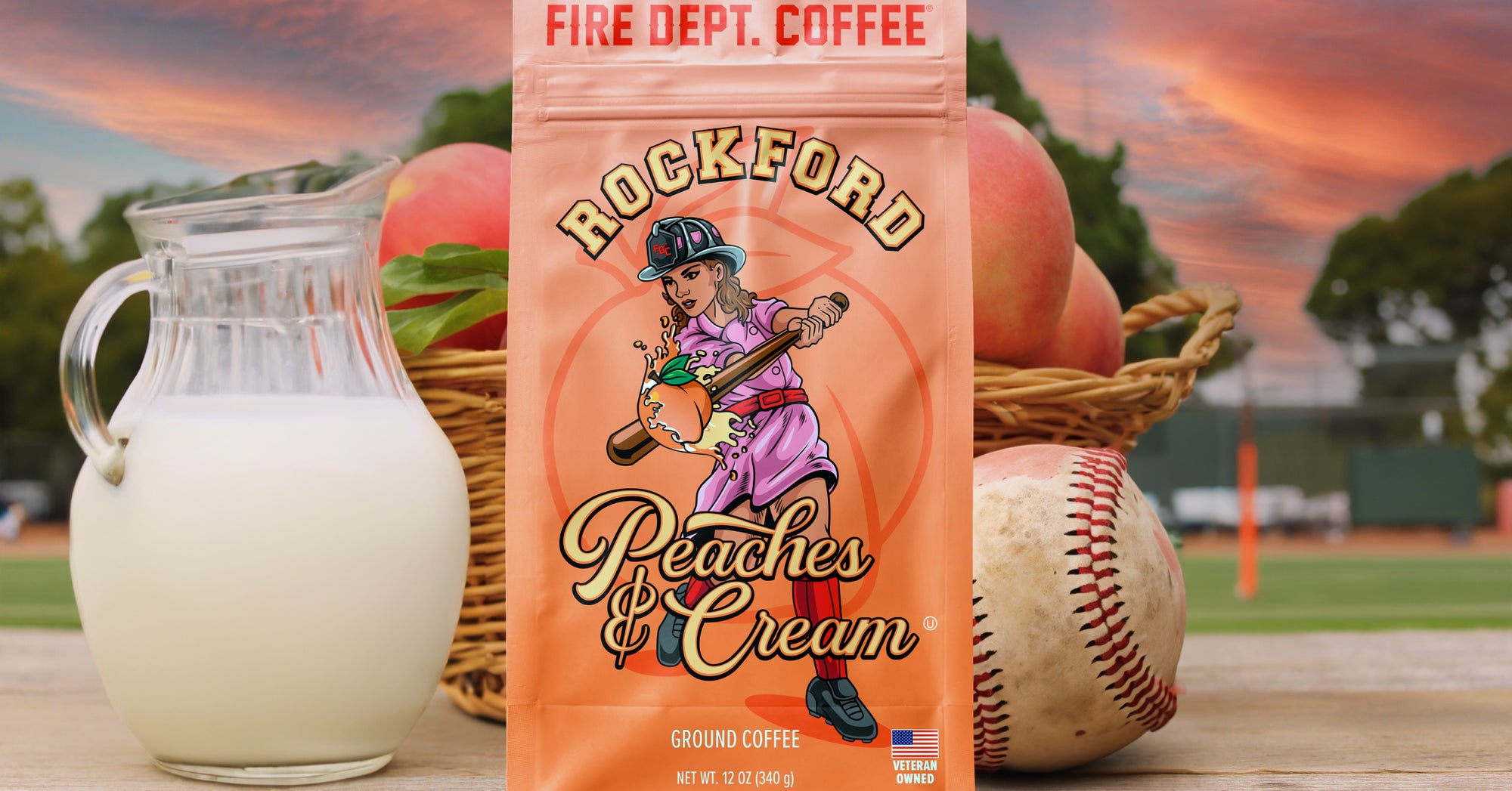 Bag of peaches and cream coffee with a baseball field in the background.