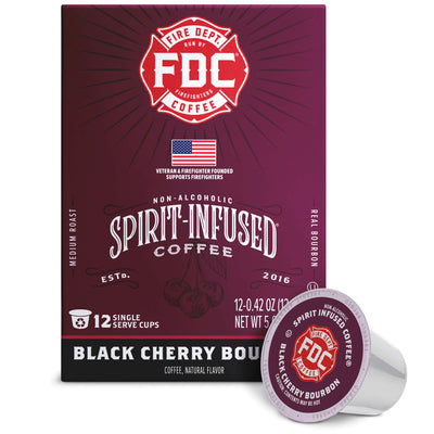A box of FDC Fire Department Spirit-Infused Coffee in Black Cherry Bourbon flavor, shown alongside a single single-serve coffee capsule on a clean white background.
