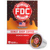 A box of FDC Fire Department Coffee Donut Shop Coffee with a single single-serve coffee pod placed in front on a white background.