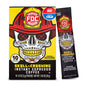 A box and single stick pack of FDC Fire Department Skull-Crushing Instant Espresso Coffee, featuring a graphic of a skull wearing a firefighter helmet on a yellow and black background.