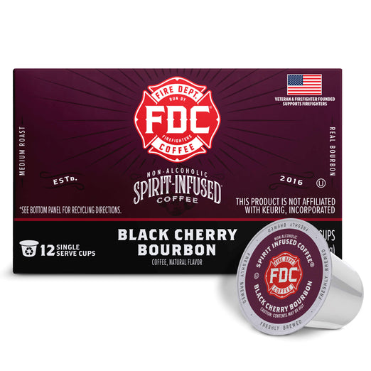 A box of FDC Fire Department Spirit Infused Coffee in Black Cherry Bourbon flavor, shown alongside two individual single-serve coffee capsules on a clean white background.