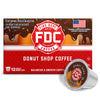 A box of FDC Fire Department Coffee 'Donut Shop Coffee' alongside two individual single-serve coffee capsules on a clean white background.