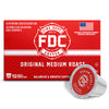 A red box of FDC Fire Department Coffee Original Medium Roast coffee capsules, shown with one silver and red single-serve coffee capsule in front on a white background.