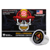 FCO Coffee 'Skull-Crushing' Espresso Coffee packaging box with a large skull wearing a firefighter helmet graphic, plus one loose single-serve coffee capsule in front on a white background.