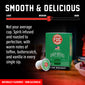 FDC Irish Whiskey coffee pods and box on a dark wooden surface with a red and black promotional background. The image includes text describing the coffee as spirit-infused and roasted to perfection, with a slider graphic labeled Light, Medium, and Dark.