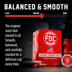 A red box of FDC Fire Department Coffee Single Serve K-Cups with one single-serve coffee capsule placed in front on a white background.