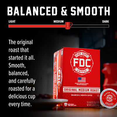 A red box of FDC Fire Department Coffee Single Serve K-Cups with one single-serve coffee capsule placed in front on a white background.