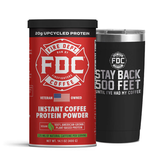 A can of Fire Department Coffee Instant Coffee Protein Powder next to a 20 ounce Fire Department Coffee black Stay Back Tumbler