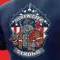 Navy blue shirt with a graphic of a firefighter dog holding axes, featuring ’Screw City Strong’ text on a red background.

