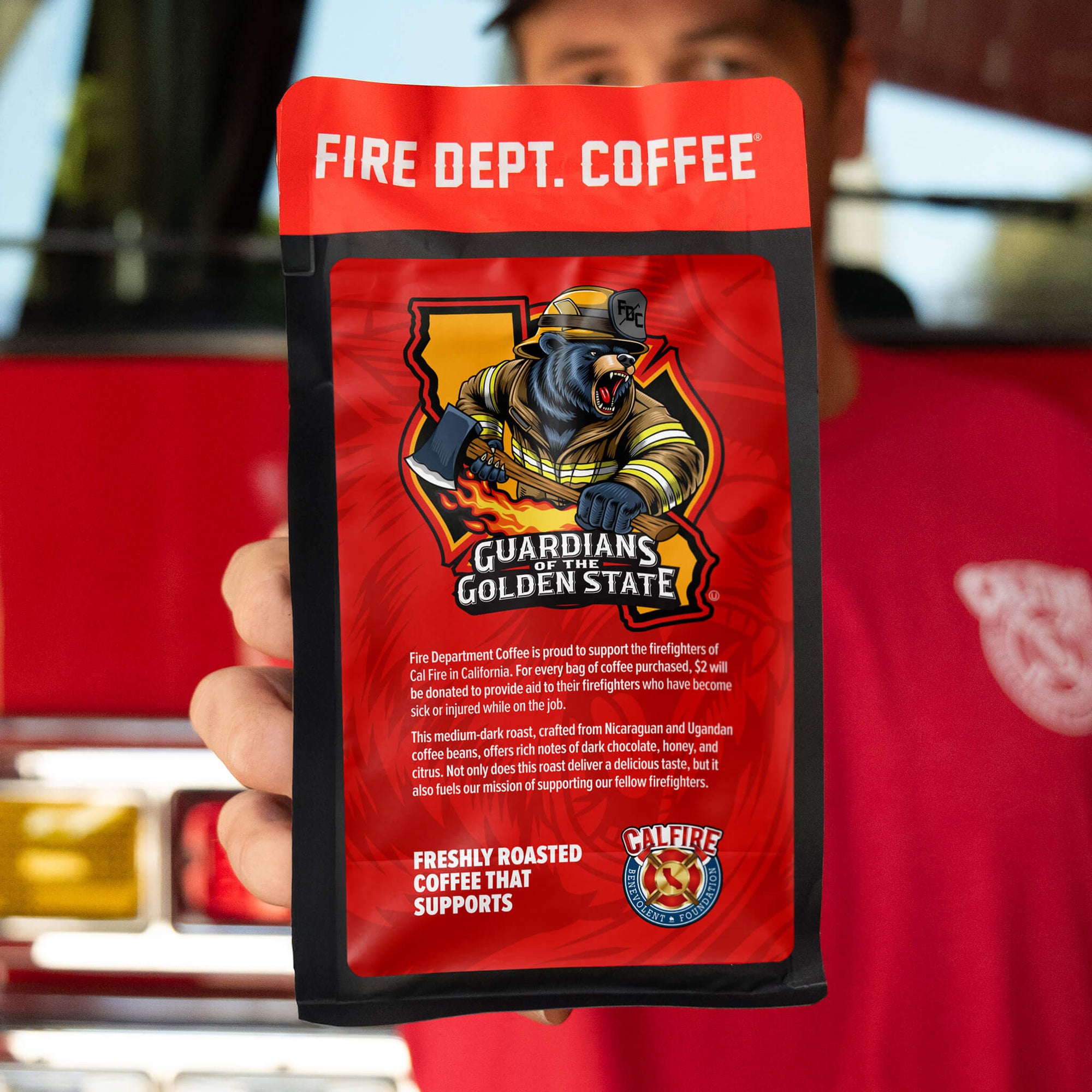 A coffee bag featuring the 'Guardians of the Golden State' design and the CalFire Benevolent Foundation logo in the bottom right corner.
