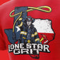 Red t-shirt with a graphic of a firefighter holding a rope, set against a map of Texas, with ’Lone Star Grit’ text.

