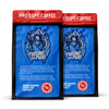 Two packages of Fire Dept. Coffee with blue and red design on a white background