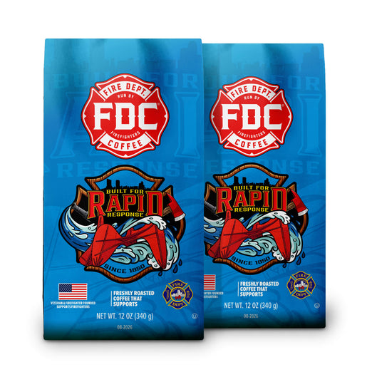 Two blue bags of FDC Fire Department Coffee side by side, featuring a red and white FDC logo and a wave graphic with red and white elements.