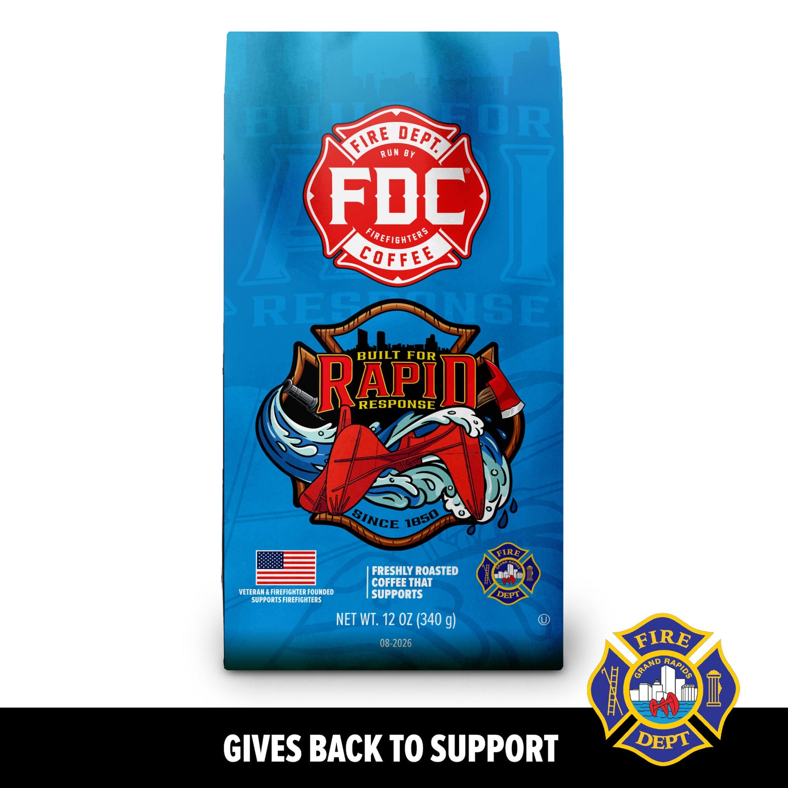 A blue bag of FDC Fire Department Coffee featuring a red fire department emblem and an illustration of a fire truck and firefighter gear, with the text 'GIVES BACK TO SUPPORT' below on a black background.