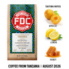 A bag of FDC Firefighters Coffee, Tanzania, August 2026, displayed next to flavor illustrations of apricot, lemon, and honey with tasting notes on a white background.