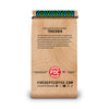 A single stand-up coffee bag with a wood-grain style print and a colorful geometric pattern around the rolled top, shown on a plain white background. Visible text includes 'Coffee from the Region of Mt.