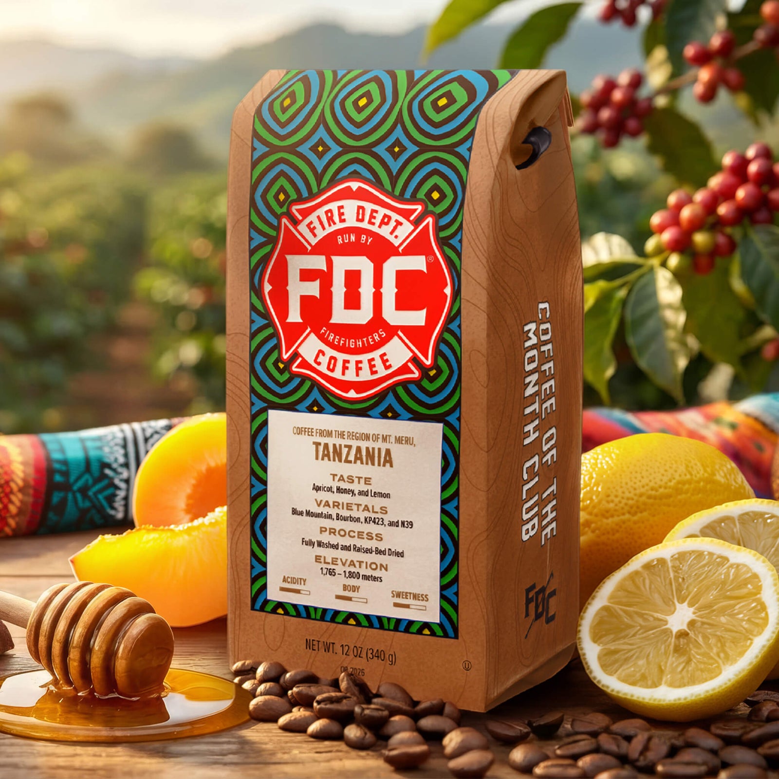 A bag of FDC Firefighters Coffee, Tanzania, August 2026, displayed next to flavor illustrations of apricot, lemon, and honey with tasting notes on a white background.
