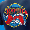 Close-up of a navy blue T-shirt showing a large red, yellow, and blue graphic on the chest with the words 'Built for Rapid Response' and 'Since 1850'.