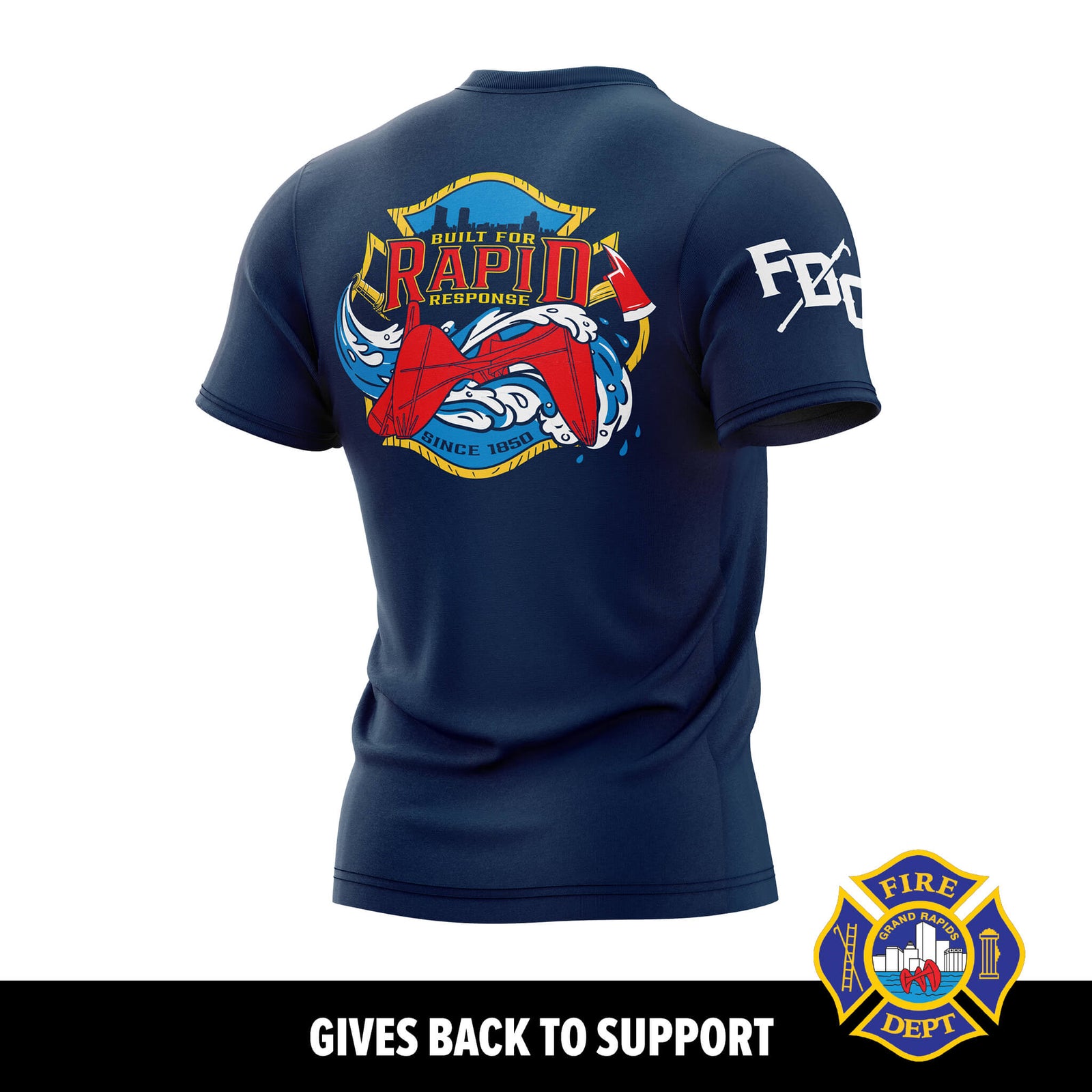 A navy blue short-sleeve t-shirt shown from the back, featuring a large graphic print with a firefighter helmet, red helmet, and the words 'Built for Rapid Response' on the back, and 'FDG' on the sleeve. A black banner at the bottom reads 'GIVES BACK TO SUPPORT' with a smaller version of the fire department emblem in the lower right corner.