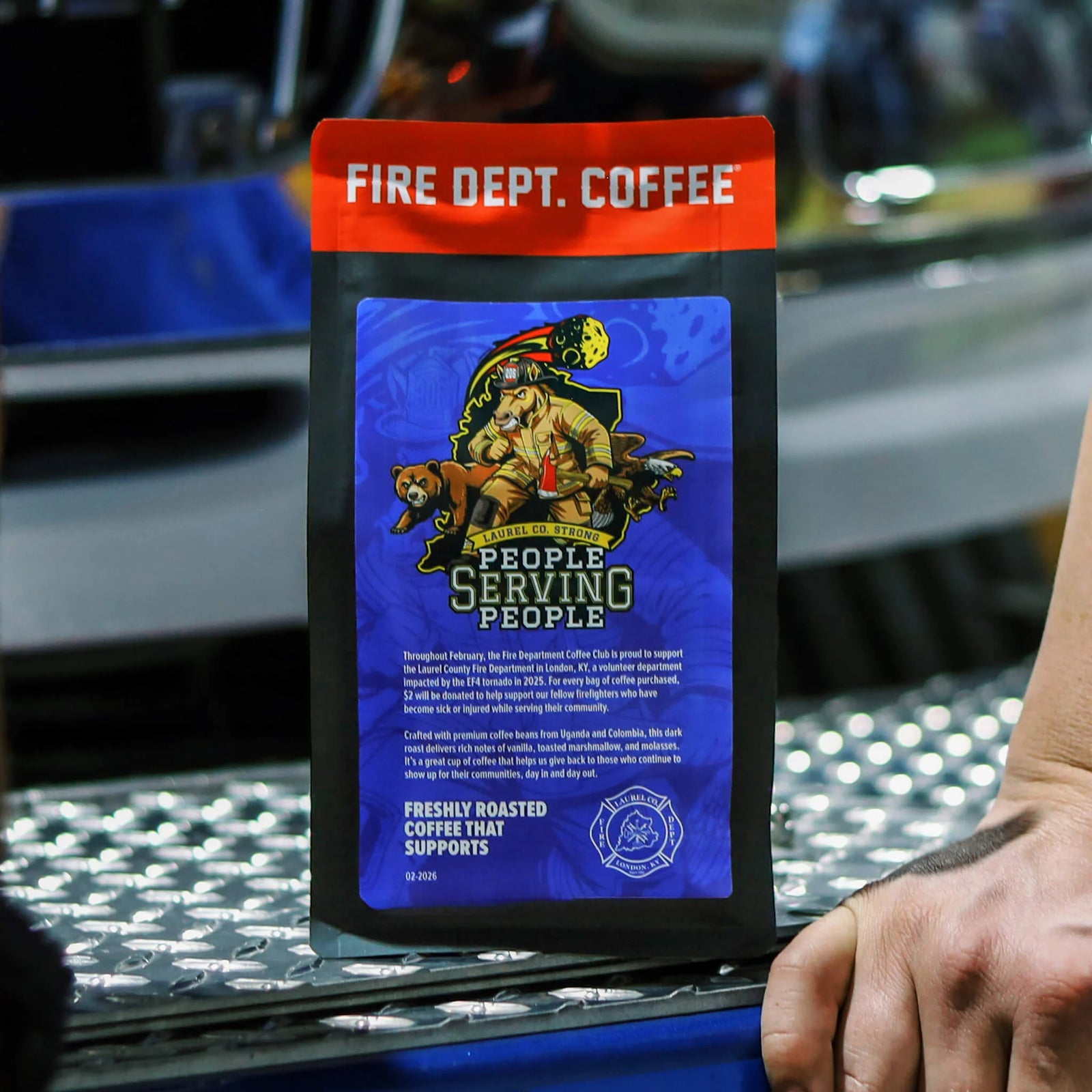 Fire Department Coffee package with bear and firefighter graphic on a blue background