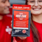 Person holding a Fire Dept. Coffee Res Cue package with blurred background