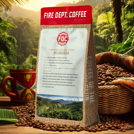 Fire Dept. Coffee package with coffee beans and a mug in a scenic setting