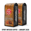 Two bags of FDC Coffee's Spirit Infused Salted Caramel Mocha Whiskey coffee on a white background.