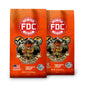 Two bags of FDC Fire Department Coffee on a plain white background. The bags are bright orange with a red and white FDC logo and an illustration of an elephant dressed as a firefighter.