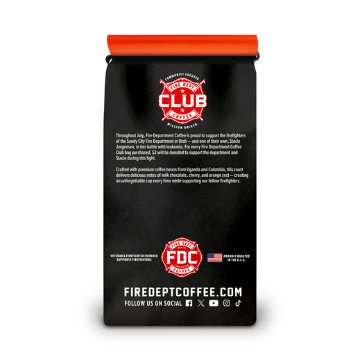 Black coffee bag with red and pink branding on a white background