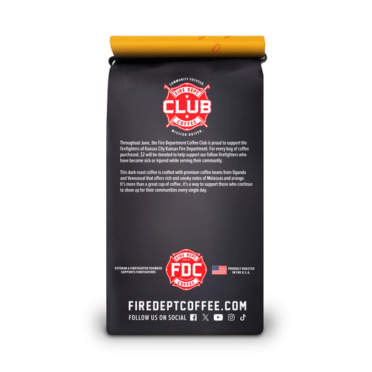 Black coffee bag with red and yellow branding on a white background