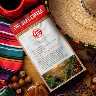 Fire Dept. Coffee package with tasting notes for caramel and hazelnut, featuring a farmer and coffee beans on a white background.