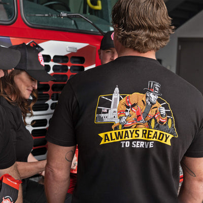 Black t-shirt with graphic design and text 'Always Ready to Serve' on a white background