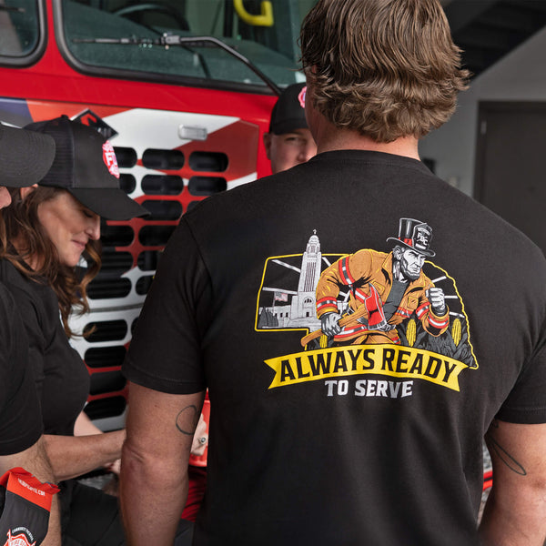 Black t-shirt with graphic design and text 'Always Ready to Serve' on a white background