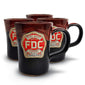 A group of four Fire Department Coffee Hand Dipped 10 Year Anniversary Pottery Mugs with a white background. 