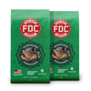 Two green bags of FDC Fire Dept. Coffee on a white background