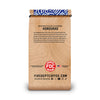 Wooden coffee bag with branding and text on a white background