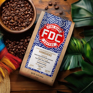 FDC Coffee bag with tasting notes for graham cracker, dark chocolate, and caramel.