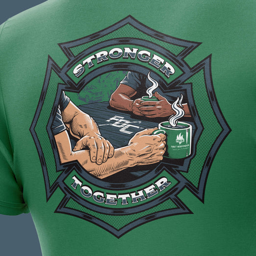 Green t-shirt with a graphic of two arms holding coffee mugs and the text ’Stronger Together’ on a green background.