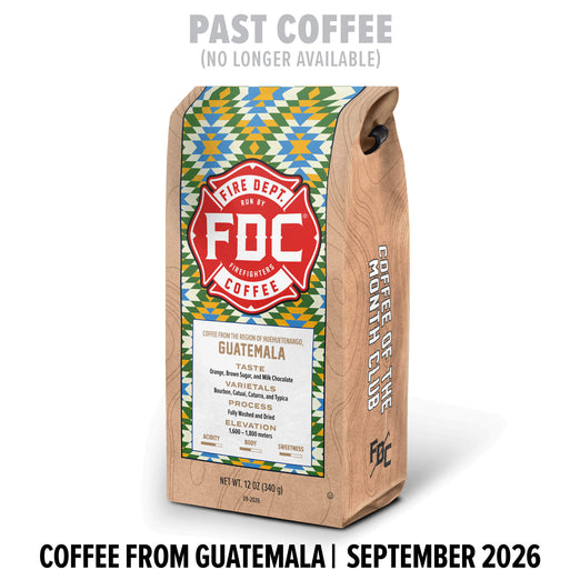 A bag of FDC Coffee from Tanzania stands upright on a white background. The package has a natural wood-toned side and a colorful geometric label in green, blue, and red.